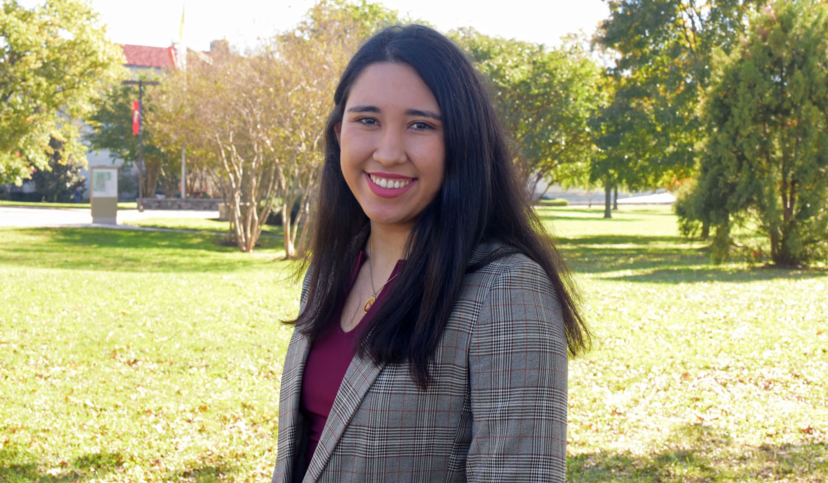 Student Lizetthe Moreno smiling on CUA campus