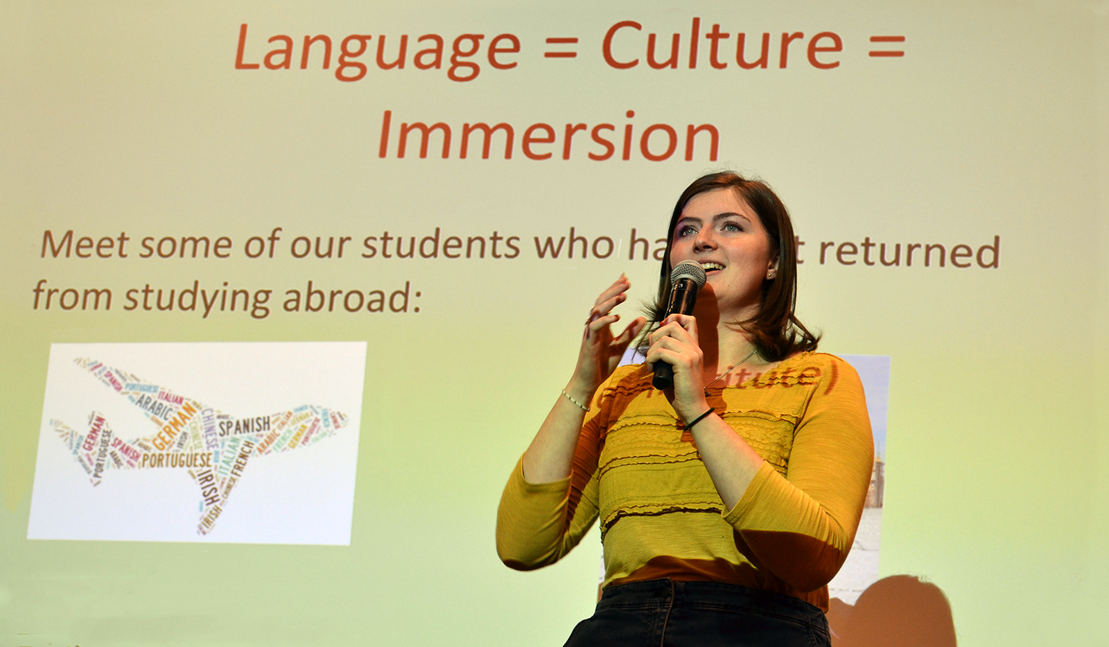 Smiling student doing a presentation